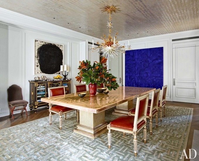 Alternate stripe orientation in a checkerboard pattern. This area rug is composed of tiles that have a light striped grain running through them, and the vertical and the horizontal have been arranged in a checkerboard.