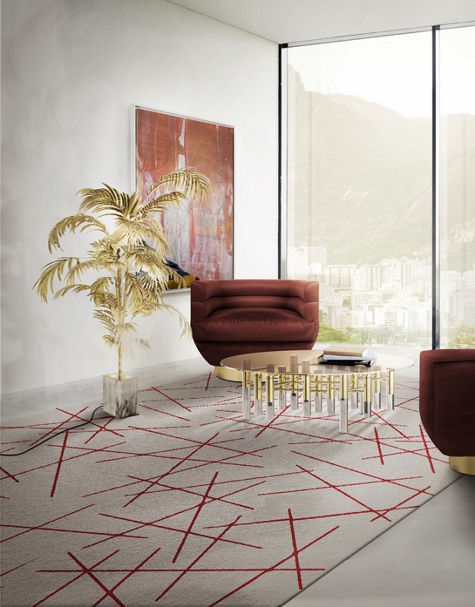 A round modern rug, in gray tones and red details.